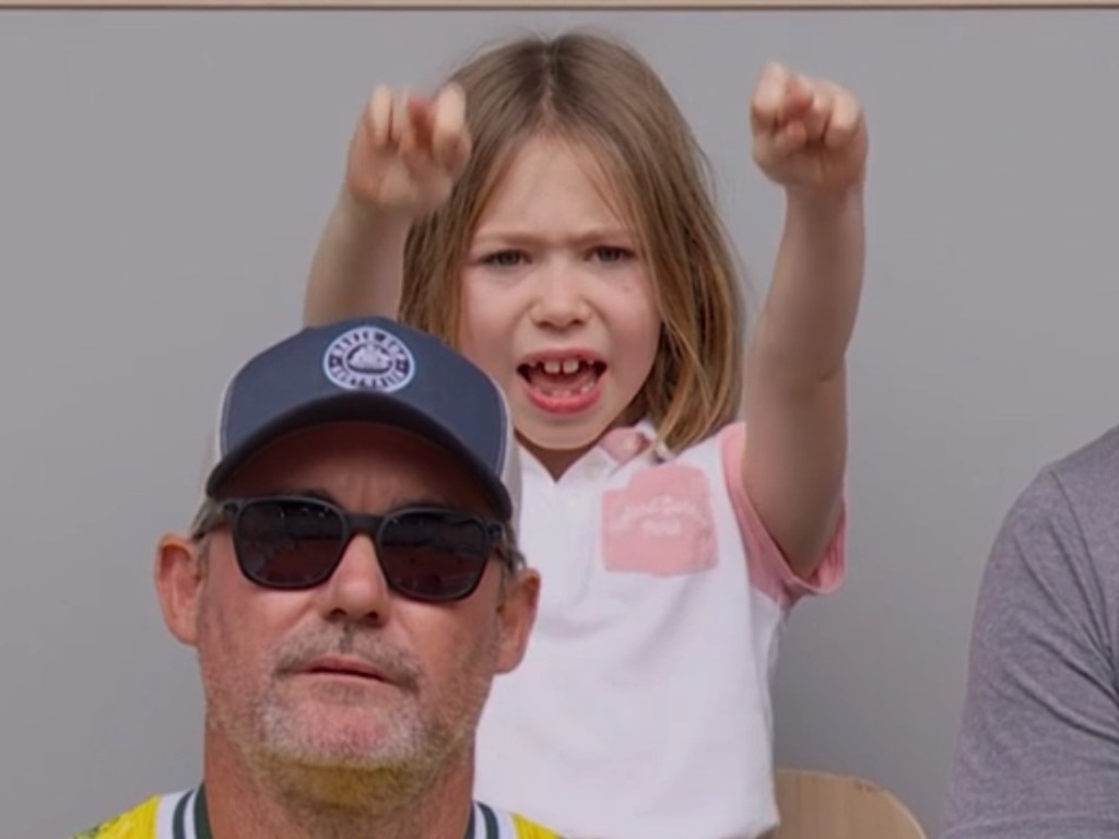 John Peers daughter Ellie crossers her fingers as she watches her dad win the Gold medal in doubles with Matthew Ebden at Roland-Garros.