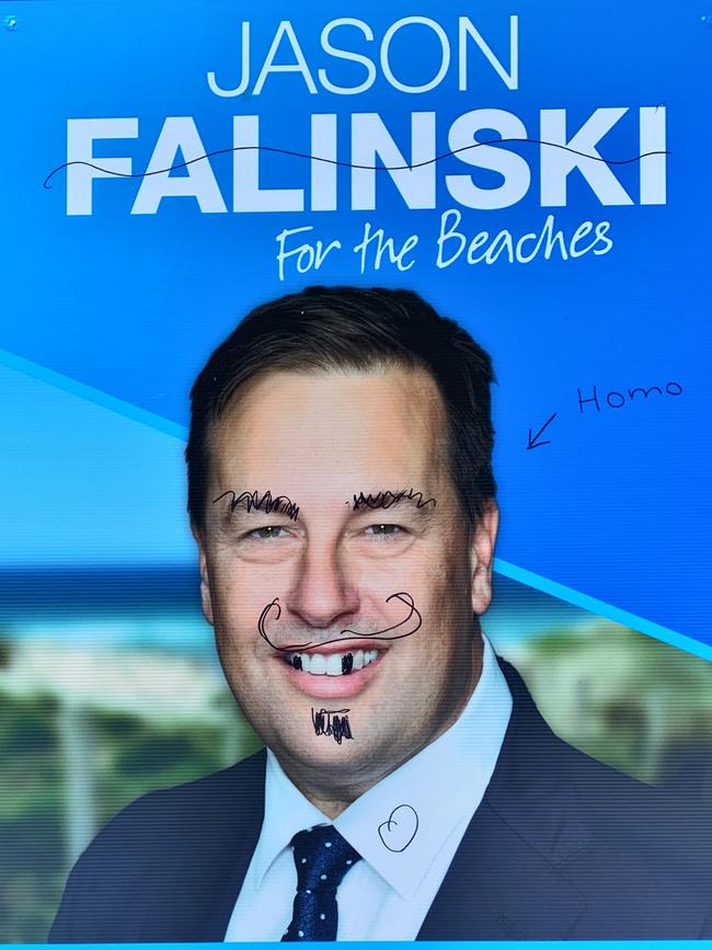 A defaced poster of Jason Falinski.