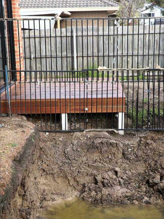 One family was left with a collapsing hole in their backyard. Picture: Alan Barber