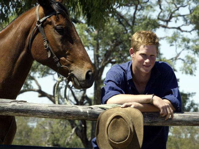 Prince Harry, pictured in QLD in 2003, has seen first-hand the plight farmers face during drought.