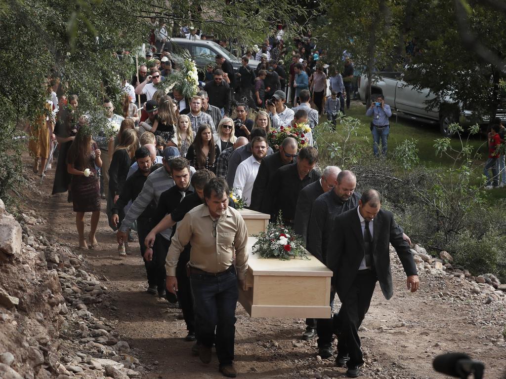 Family and friends carry the coffins of Dawna Ray Langford and her sons Trevor and Rogan. Picture: Marco Ugarte/AP