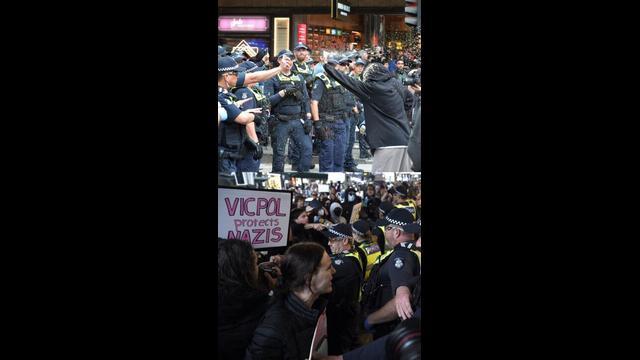 Watch as pro-trans activists clash with police in wild scenes in Melbourne