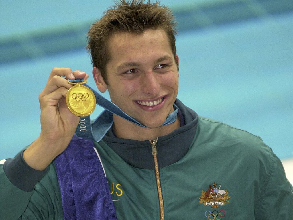 16 September 2000. Australian swimming champion Ian Thorpe celebrates winning gold in the 400m freestyle on the first day of competition at the 2000 Sydney Olympics. (AAP Photos/Julian Smith)