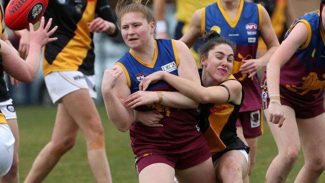 Olivia Dalmau is tackled by Holly Stevenson. Picture: Hamish Blair