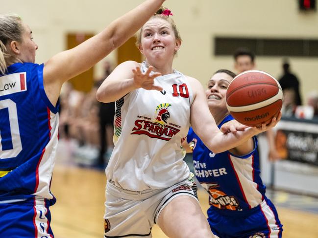 Alice Dart of SD Spartans defended by Mia Stower (left) and Tracey Twidale of Toowoomba Mountaineers in Queensland State League Division 1 womens basketball round 12 at USQ's Clive Berghofer Recreation Centre, Sunday, July 24, 2022. Picture: Kevin Farmer