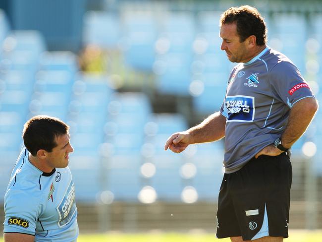 Ricky Stuart talks with Paul Gallen during a Sharks training session.