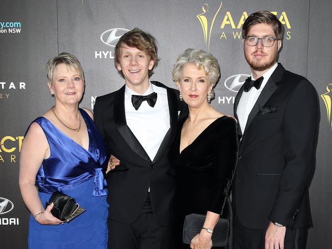 Josh Thomas with his mum (left) and the cast of Please Like Me.