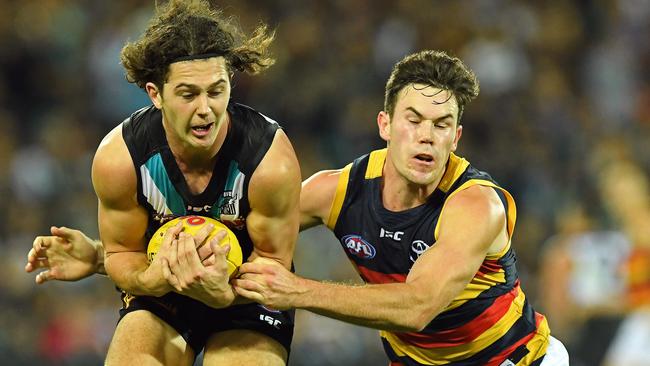 Power defender Darcy Bryne-Jones marks in front of Crow Mitch McGovern. Picture: Tom Huntley