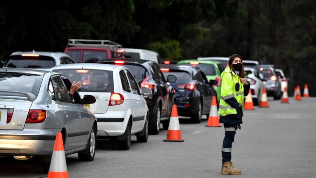 People queue in cars at the Fairfield Showground Covid testing site in Sydney today. Picture: NCA NewsWire/Joel Carrett