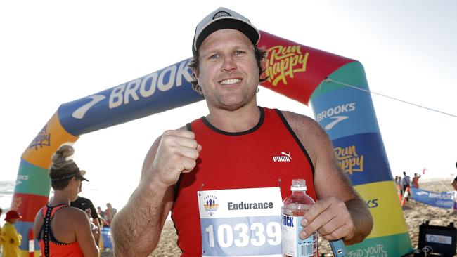 Former AFL star and commentator Campbell Brown completes the Bay to Surf Run in Portsea.