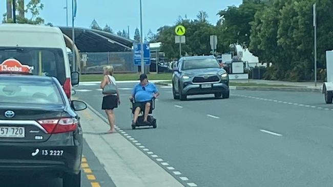 A man in a wheelchair uses the two way street to access a maxi taxi at the new taxi rank at Gold Coast Airport. Picture: Supplied