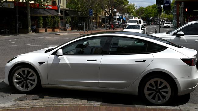 ADELAIDE, AUSTRALIA - NewsWire Photos October 20, 2022: Generic photos of electric cars and charging stations. Tesla on Gouger Street.Debate over repeal of electric vehicle levy to continue/ conclude in SA lower house. The tax forces electric vehicle owners to pay a 2.5 cent per kilometre mileage charge on zero-emission vehicles in lieu of the fuel excise not being paid. Axing the tax was an election promise of LaborÃs Peter Malinauskas. Picture: NCA NewsWire / Naomi Jellicoe