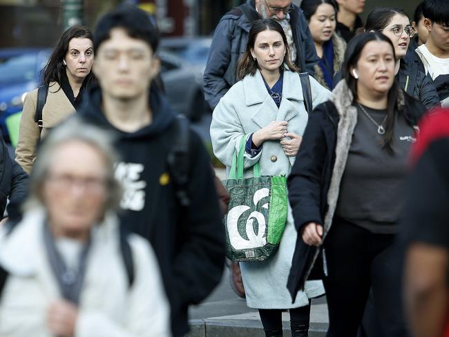 SYDNEY, AUSTRALIA - NewsWire Photos JULY 17, 2024:  Pedestrians crossing Elizabeth street   in the Sydney CBD. The Australian Bureau of Statistics, (ABS) releases it's latest job figures tomorrow.  Picture: NewsWire / John Appleyard