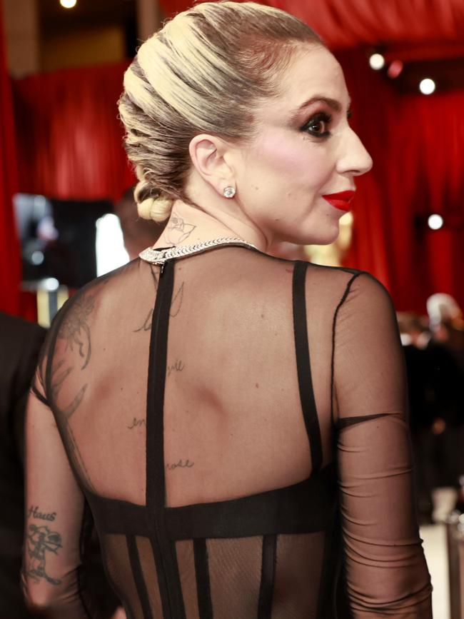 Lady Gaga showed of her torso in a Versace gown at the Oscars.