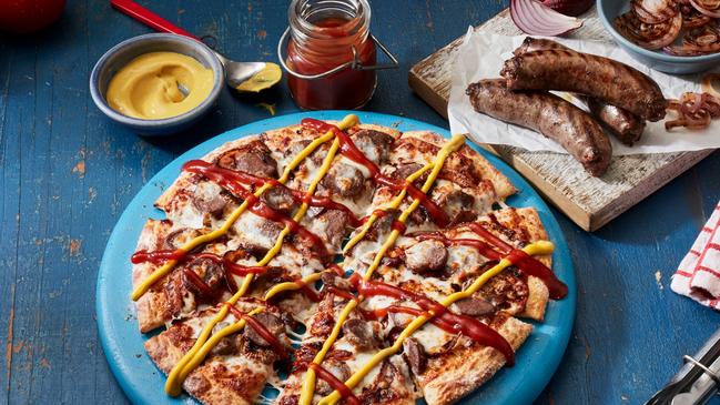 Another pandemic invention - the Sausage Sizzle Pizza - created for Aussies missing a snag outside Bunnings during lockdowns. Picture: Domino's Pizza via NCA NewsWire