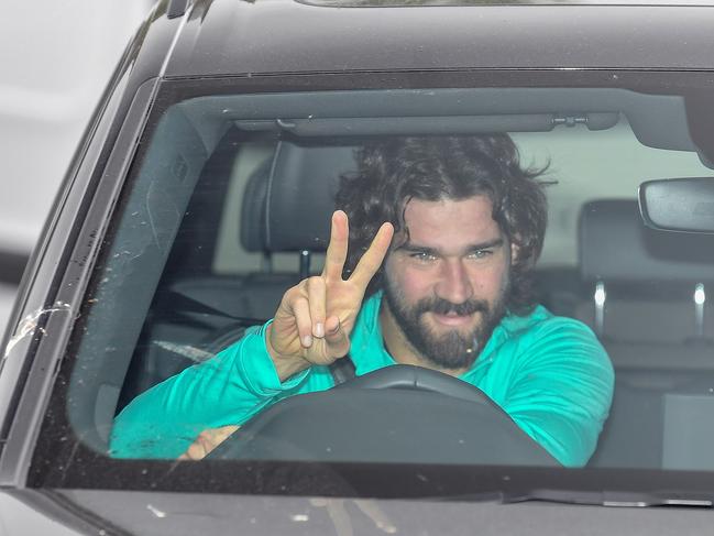 Liverpool's Brazilian goalkeeper Alisson Becker arrives at Melwood in Liverpool, north west England for a training session on May 19, 2020, as training resumes for the first time since the English Premiere League was halted due to the COVID-19 pandemic. (Photo by Paul ELLIS / AFP)