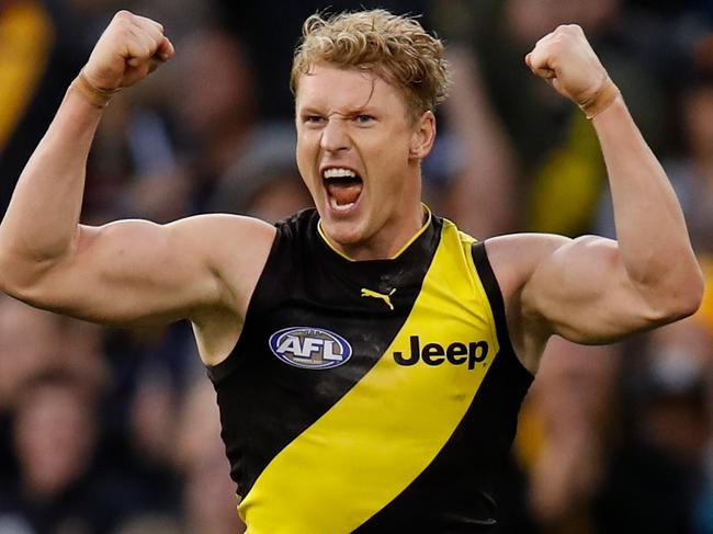 MELBOURNE, AUSTRALIA - APRIL 29: Josh Caddy of the Tigers celebrates a goal during the 2018 AFL round six match between the Collingwood Magpies and the Richmond Tigers at the Melbourne Cricket Ground on April 29, 2018 in Melbourne, Australia. (Photo by Michael Willson/AFL Media/Getty Images)