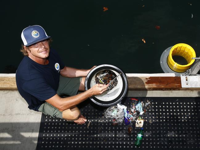 Pete Ceglinksi inspects the contents of a bin. Picture: John Appleyard