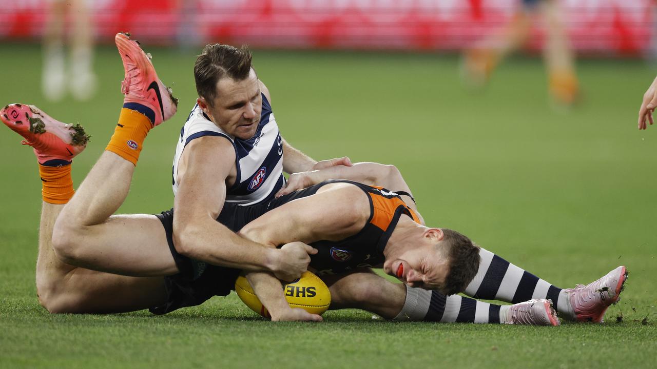 Sam Walsh of the Blues gets tackled into the turf by Patrick Dangerfield of the Cats. Pic: Michael Klein