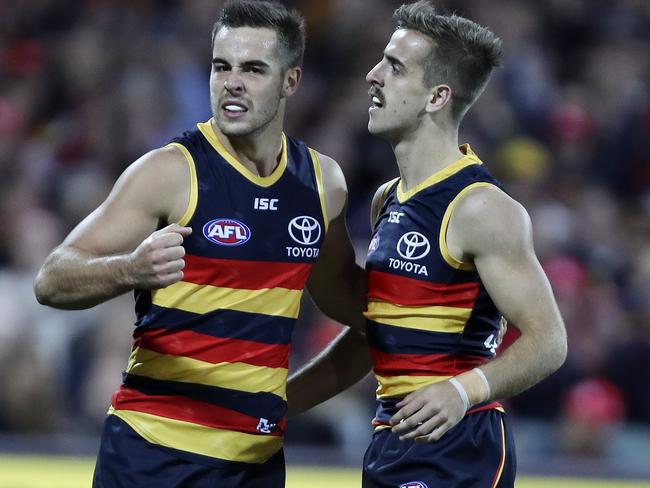 28/04/18 - AFL - Round 6 - Adelaide Crows v Gold Coast Suns at the Adelaide Oval. Jordan Gallucci (right) celebrates his goal with Myles Poholke. Picture SARAH REED