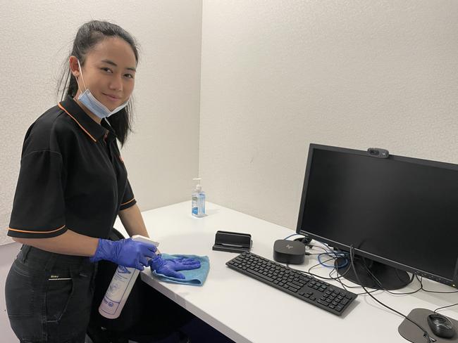 Cleaner Malliga Miller tidies up an office ready for the next working day at Southgate. Picture: Kiel Egging.