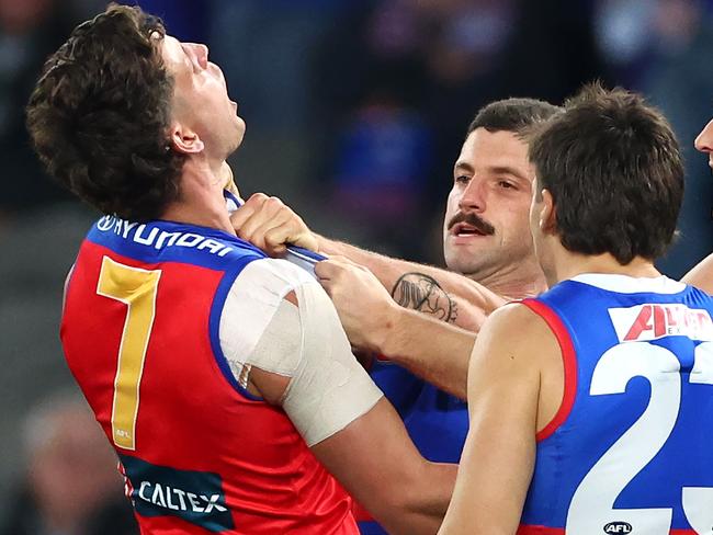 Tom Liberatore shoves Jarrod Berry. (Photo by Quinn Rooney/Getty Images)