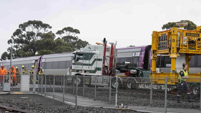 Emergency services at the scene of a fatal collision at a level crossing in North Shore. Picture: Brad Fleet