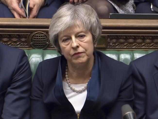 In this grab taken from video, Britain's Prime Minister Theresa May listens to Labour leader Jeremy Corbyn speaking after losing a vote on her Brexit deal, in the House of Commons, London, Tuesday Jan. 15, 2019.  British lawmakers have plunged Brexit into chaos and the U.K. politics into crisis by rejecting Prime Minister Theresa May's divorce deal with the European Union. The 432 to 202 vote in the House of Commons was widely expected but still devastating for May, whose fragile leadership is now under siege. (House of Commons/PA via AP)