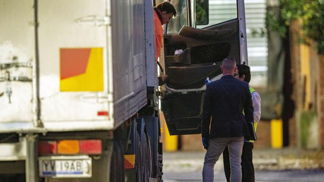 A truck driver arriving at Cedar Meats has his temperature taken. Picture: Getty Images.