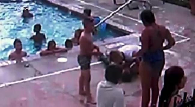 Security footage shows the moment the unconscious boy was dragged from the pool. Source: CCTV/KSat