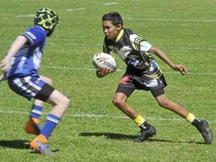 Zakye Swan-Pearce puts in a step in the under-13 Group 1 grand final between the Grafton Ghosts and the Clarence Coast Magpies at Frank McGuren Field on Saturday. Picture: Mitchell Keenan