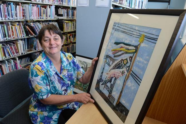 Lismore Librarian Lucy Kinsley with Japanaese prints featuring in the HeART and Peace exhibition. Picture: Cathy Adams