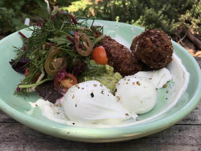 Corn fritters with poached eggs. Picture: Jenifer Jagielski