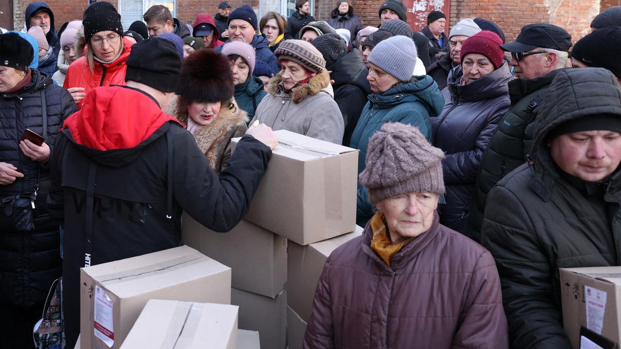 Local residents receive food kits distributed by volunteers with the financial support of the UK Government, in Sloviansk, Donetsk region amid the Russian invasion of Ukraine. Picture: AFP