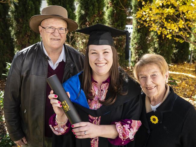 Master of Research graduate Catherine Chinnock with proud parents Ian and Carol Kennedy at the UniSQ graduation ceremony at Empire Theatres, Tuesday, June 27, 2023. Picture: Kevin Farmer