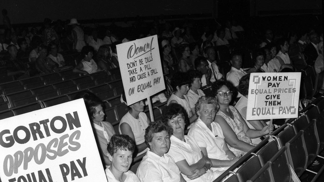 Women display posters in support of equal pay at City Hall in 1969. Picture: Ted Holliday