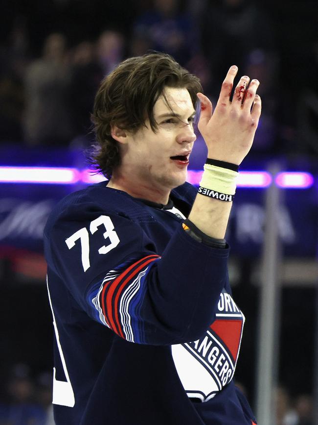 Matt Rempe hyped up the crowd but his knuckles were clearly bloody. Photo by Bruce Bennett/Getty Images