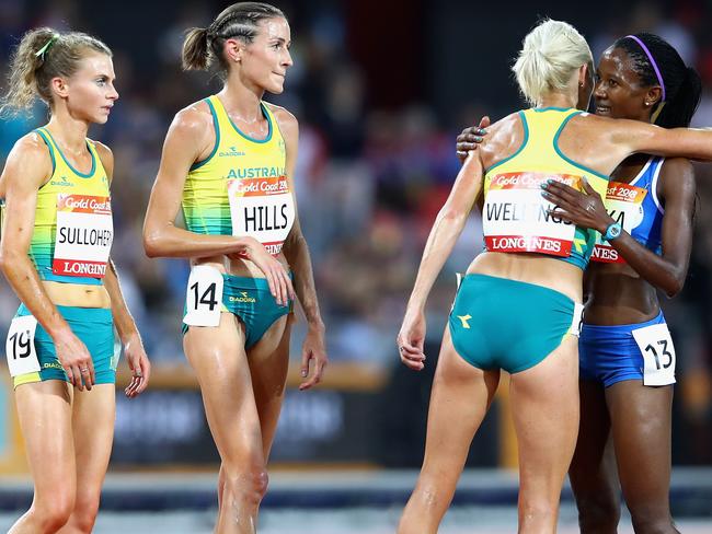 GOLD COAST, AUSTRALIA - APRIL 09:  Lineo Chaka of Lesotho is greeted by Eloise Wellings of Australia, Madeline Hills of Australia and Celia Sullohern of Australia as she finishes the Women's 10,000 metres final during the Athletics on day five of the Gold Coast 2018 Commonwealth Games at Carrara Stadium on April 9, 2018 on the Gold Coast, Australia.  (Photo by Mark Kolbe/Getty Images)