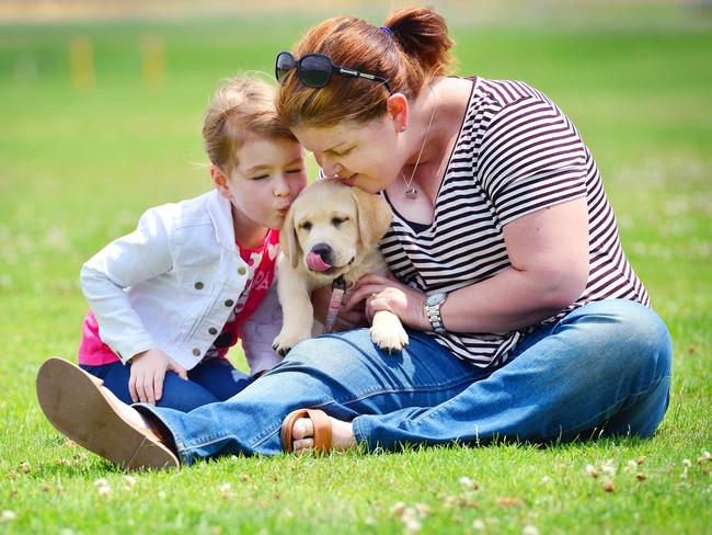 Bec Lee with her daughter Paige, 5, and their labrador puppy, Maggie. Picture: Nicki Connolly.