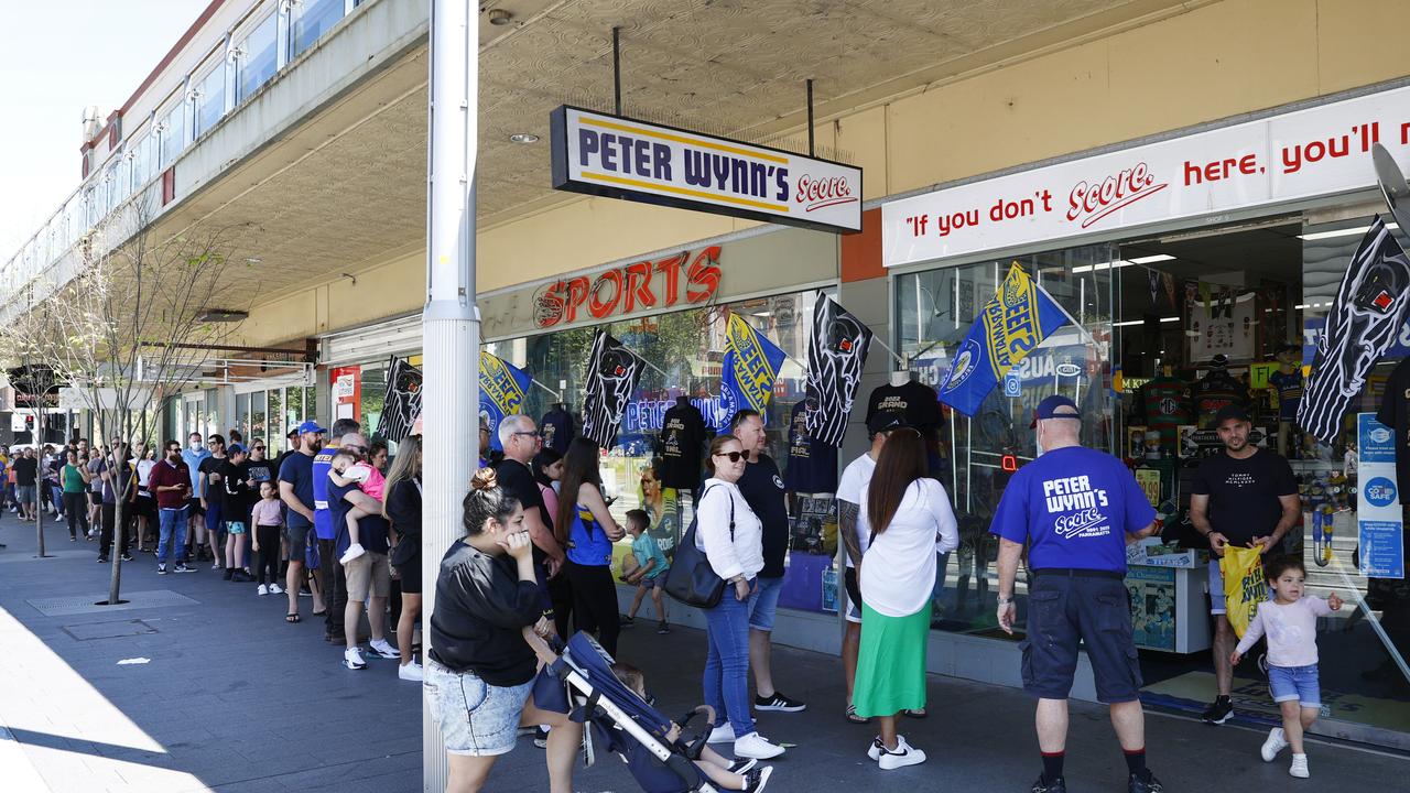 Patient crowds are prepared to line up until they buy their merchandise. Picture: Richard Dobson