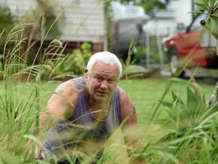 Michael Iveli said he was frustrated after trying to get Council to removed 6ft overgrown grass at the front of his home. Picture: Marc Stapelberg