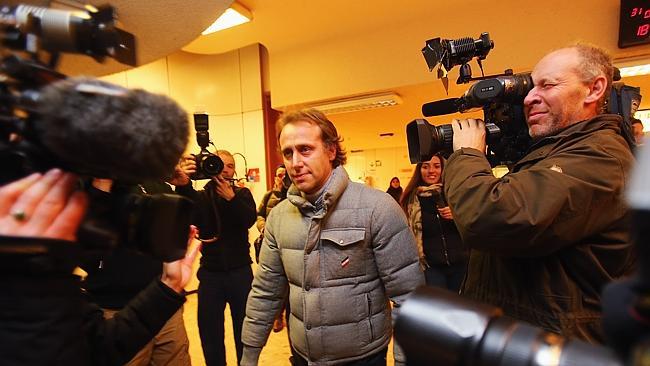 Former Italian Formula One driver Luca Badoer leaves the Grenoble University Hospital Centre where former German Formula One ...