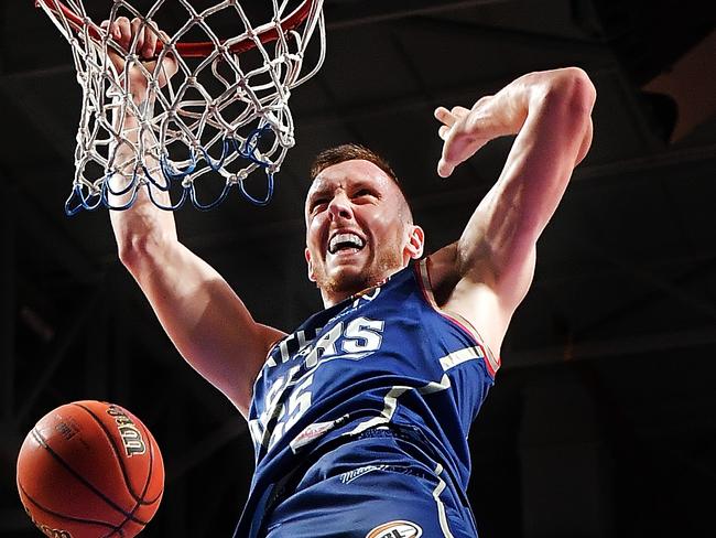 ADELAIDE, AUSTRALIA - MARCH 18: (EDITORS NOTE: Image was altered with digital filters.) Mitch Creek of the Adelaide 36ers dunks  during game two of the NBL Grand Final series between the Adelaide 36ers and Melbourne United at Titanium Security Area on March 18, 2018 in Adelaide, Australia.  (Photo by Daniel Kalisz/Getty Images) *** BESTPIX ***