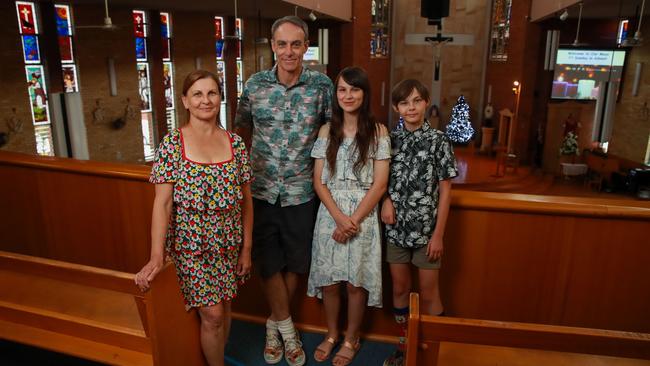 Barbara Godlewski and Bruce Stewart, with their children Eloise Godlewski, 14, and Sascha Stewart, 10, at St Aloysius Catholic Church, Cronulla, on Wednesday ahead of the relaxing of COVID restrictions on church services. Picture: Justin Lloyd