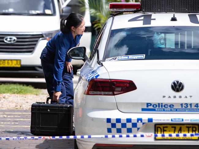 A crime scene officer outside the Greystanes house on Saturday. Picture: Julian Andrews.