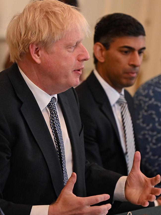 Rishi Sunak listens as Boris Johnson speaks at the start of a cabinet meeting in Downing Street on Tuesday. Picture: Pool / AFP