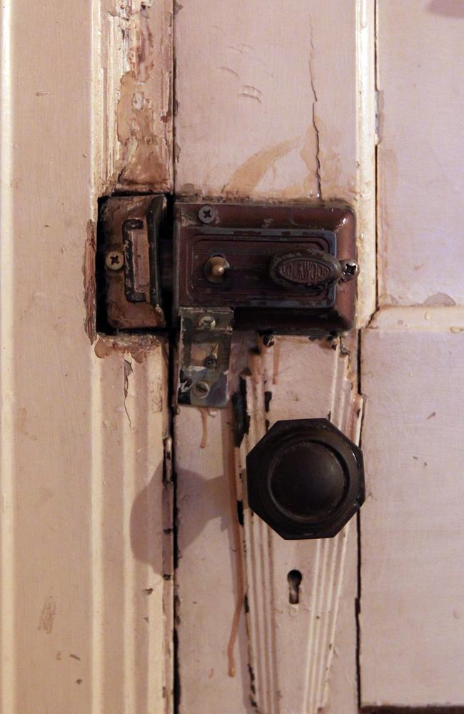 Crumbling: A door lock and handle inside a double room at the Gatwick. Picture: News Corp.