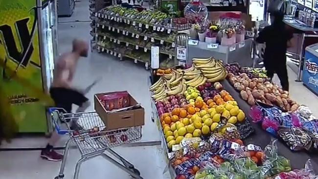 Dramatic CCTV vision shows a shirtless man chasing an alleged attempted shoplifter out of an Adelaide IGA with a machete., Picture: 9News