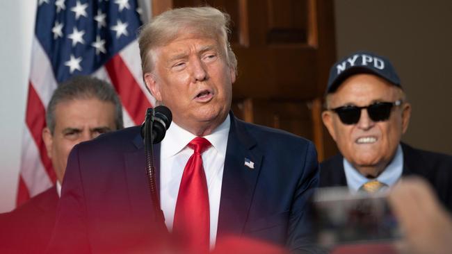 Giuliani, rear, as President Donald Trumps addresses the City of New York Police Benevolent Association at the Trump National Golf Club in Bedminster, New Jersey, in August. Picture: AFP