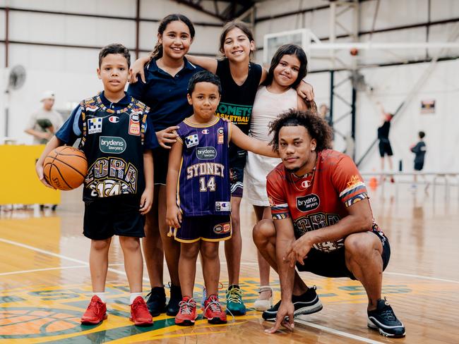 Sydney Kings rookie Biwali Bayles returned to his junior club – the Sydney Comets – to present the Kings’ Indigenous round singlet to officials and the kids. Picture: Sam Tolhurst